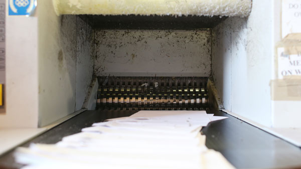 Industrial Shredder with paper going into it