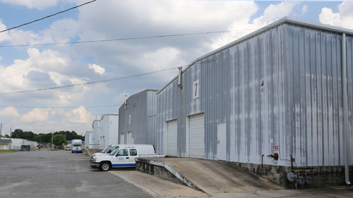 ABC Moving & Storage Records Storage secure warehouses, outside with vans in front of the building